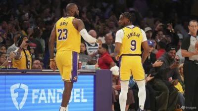 Ken Griffey-Junior - LeBron, Bronny James make NBA history with father-son appearance - channelnewsasia.com - Los Angeles - state Minnesota
