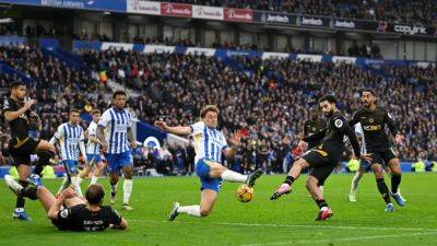 Tactical switch gives Wolves unlikely point away to Brighton after late drama