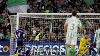 Gimenez's own goal ends Atletico's unbeaten run in 1-0 defeat at Betis