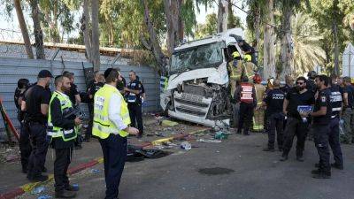 Truck rams into Tel Aviv bus stop, killing one and wounding dozens in suspected terror attack