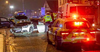 Dramatic photos show car roof cut off after person rescued in smash on main road