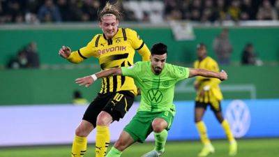 Wolfsburg dump Dortmund out of German Cup with extra-time winner