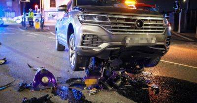 Police car lands on top of motorbike after reports of high-speed 'chase' before road cordoned off