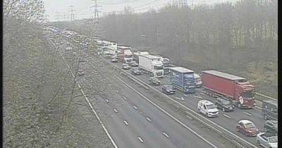 M56 LIVE: Huge two-HOUR delays with 11-mile queues on motorway - latest updates