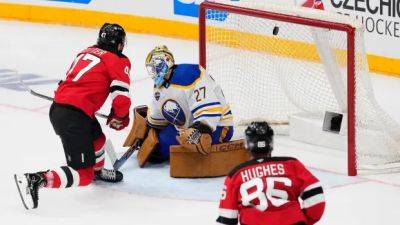 Cotter scores as Devils beat Sabres 3-1 to sweep season-opening series in Prague