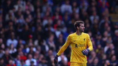 Liverpool keeper Alisson set to be out for a month with hamstring injury