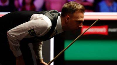 Wuhan cue confusion fails to derail Judd Trump