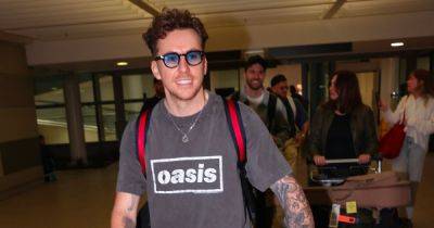 ITV I'm A Celeb's Danny Jones sports Oasis tee as he's pictured arriving in Australia