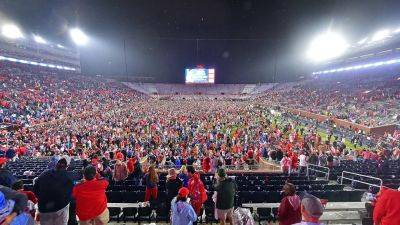 Ole Miss - Justin Ford - Ole Miss fans storm field with time remaining on clock, prompting delay to game's end - foxnews.com - Georgia - state Mississippi - county Oxford