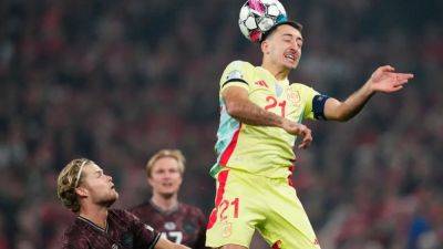 Spain top Nations League group with 2-1 win at Denmark