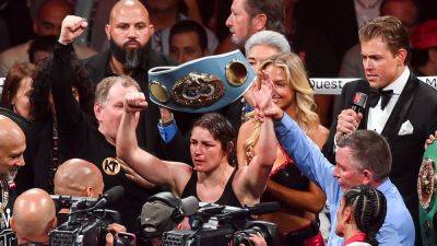 Katie Taylor edges Amanda Serrano in bloody battle to retain world titles
