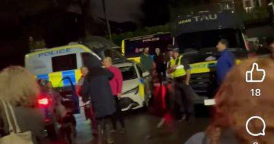 Extraordinary scenes as row erupts on quiet suburban street over dog's welfare