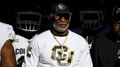 Colorado's Deion Sanders ignores talk, 'ain't going nowhere' - ESPN