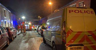 Man taken to hospital after being pulled from house fire