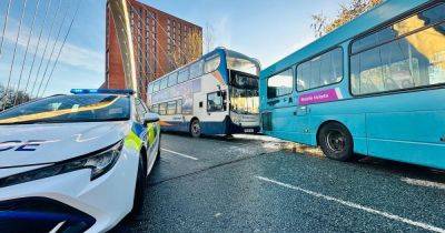 Busy road blocked and police on scene as two buses smash into each other
