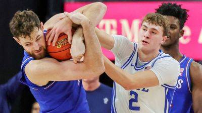 Kansas' Dickinson ejected for kicking Duke's Brown in face - ESPN