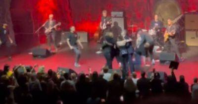 Morrissey rushed off during performance after crowd storms stage