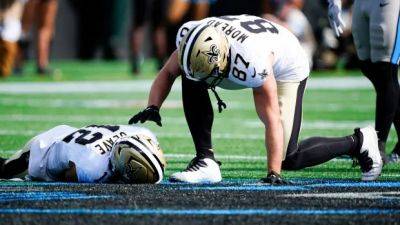 Chris Olave - Saints' Chris Olave carted off the field after suffering 2nd concussion of the season - cbc.ca