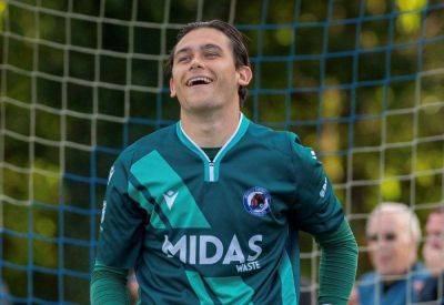 Goalkeeper makes wonder save while trapped in the net with footage viewed thousands of times