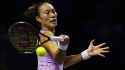 Zheng beats Paolini to march into WTA Finals semis