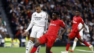 Real Madrid move up to second with 4-2 win over Sevilla