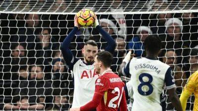 Liverpool hit Tottenham for six to cement top spot, Chelsea held