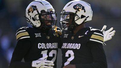 Colorado adds record insurance coverage for QB Sanders, Hunter - ESPN