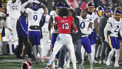 East Carolina-NC State fight mars end of Military Bowl, ref left bloodied - foxnews.com - state North Carolina