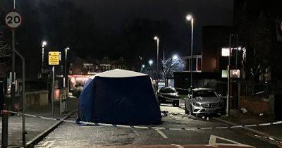 Forensics tent in place and neighbours left shocked after man seriously injured in robbery
