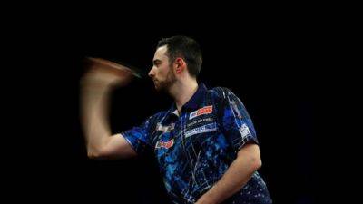 Darts-Reigning champion Humphries shocked by Wright at World Championship