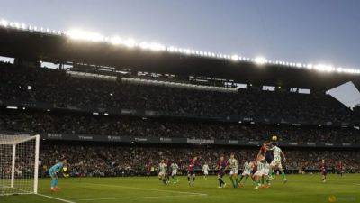Barcelona held to 2-2 draw at Betis after late Diao strike