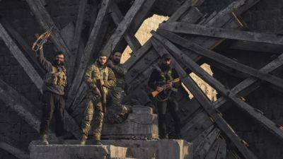 Southern - Syrian insurgents seize Damascus suburbs while state media deny Assad has fled - euronews.com - Russia - Iran - Afghanistan - Pakistan - Syria