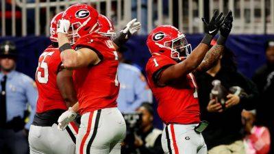 Kirby Smart - Georgia stuns Texas in OT to secure SEC title, 1st-round CFP bye - ESPN - espn.com - Georgia - county Day - state Texas