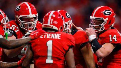 Kirby Smart - Todd Kirkland - Quinn Ewers - Georgia wins SEC in OT thriller over Texas despite Carson Beck’s injury, earns bye in College Football Playoff - foxnews.com - Georgia - state Texas - county Early - county Carson