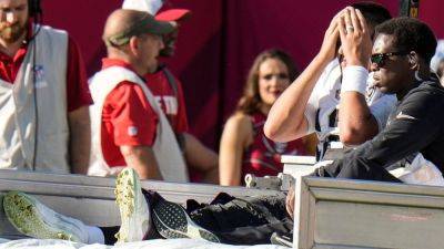 Raiders QB Aidan O'Connell carted off in loss with knee injury - ESPN