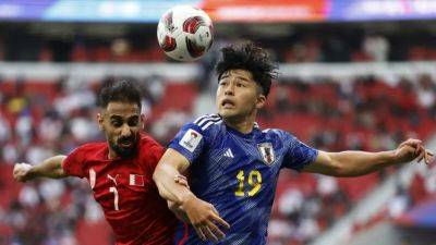 Japan cruise into Asian Cup quarter-finals with 3-1 win over Bahrain - channelnewsasia.com - Japan - Iran - Saudi Arabia - Bahrain - Syria