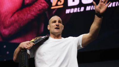 UFC star Sean Strickland calls Machine Gun Kelly a 'weird dude' during heated confrontation