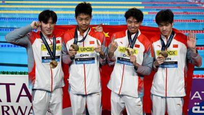 Pan Zhanle swims record 100 meters as China wins relay gold - ESPN