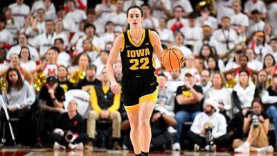 College basketball sensation Caitlin Clark nearing NCAA scoring record as Iowa hosts Michigan