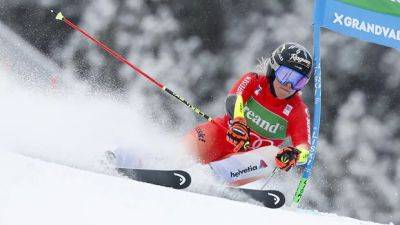 Gut-Behrami wins downhill to climb World Cup overall standings