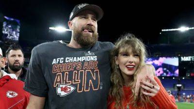 Travis Kelce, Taylor Swift sign football jersey donated to Guelph children's charity for auction
