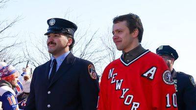Rangers honor FDNY, NYPD with jerseys while arriving in firetrucks, police cars before Stadium Series game