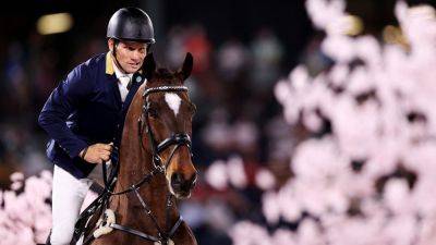 Olympic medalist sparks probe after wearing mankini at Australian show jumping event