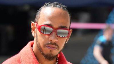F1 race ace Lewis Hamilton swaps teams from Mercedes for Ferrari