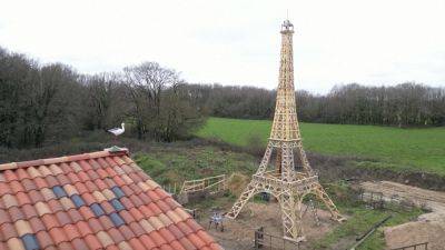 French friends build 52-foot wooden Eiffel Tower from recycled materials ahead of 2024 Olympics in Paris