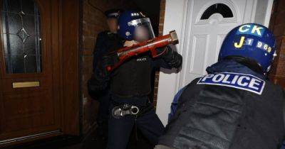 Police storm homes in 'targeted raids' across Greater Manchester borough with lethal weapon seized