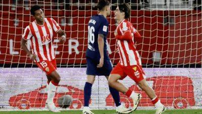Romero scores twice as bottom side Almeria hold Atletico to a draw
