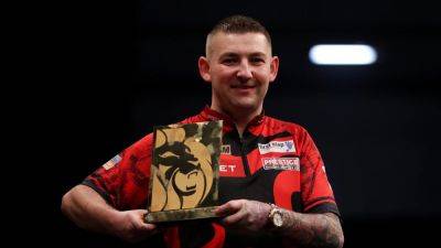 Nathan Aspinall overcomes Rob Cross to earn first Premier League darts win