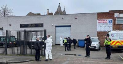 Police and forensic officers swarm funeral home after 34 bodies removed for investigation
