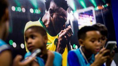 Brazil's Vinicius uses football to stimulate young Brazilian minds